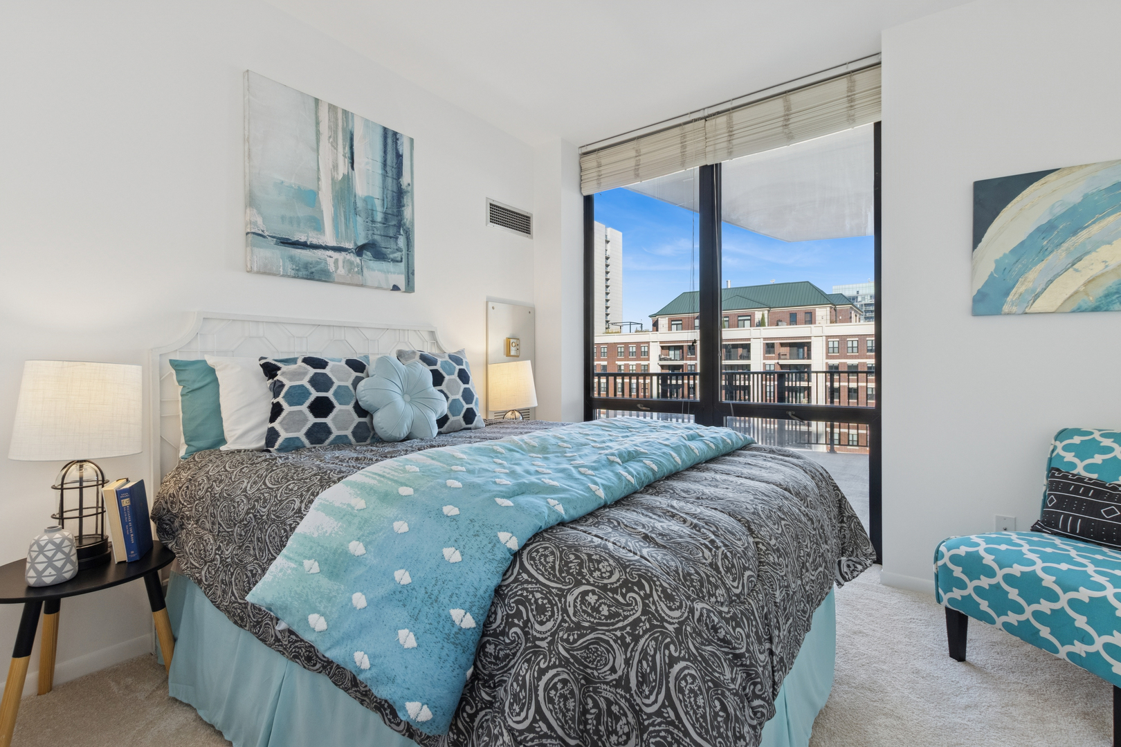 435 West Erie Street, Unit 1408 Chicago, IL 60654 - Photo 13 of 21 a bedroom with a large bed and a window