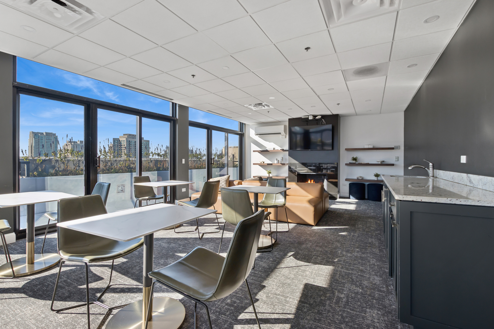 435 West Erie Street, Unit 1408 Chicago, IL 60654 - Photo 18 of 21 a living room with furniture a flat screen tv and a floor to ceiling window