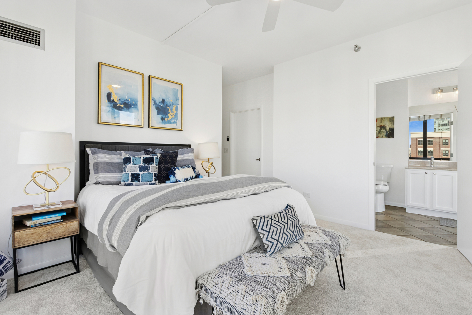 435 West Erie Street, Unit 1408 Chicago, IL 60654 - Photo 10 of 21 a bedroom with a bed and wooden floor