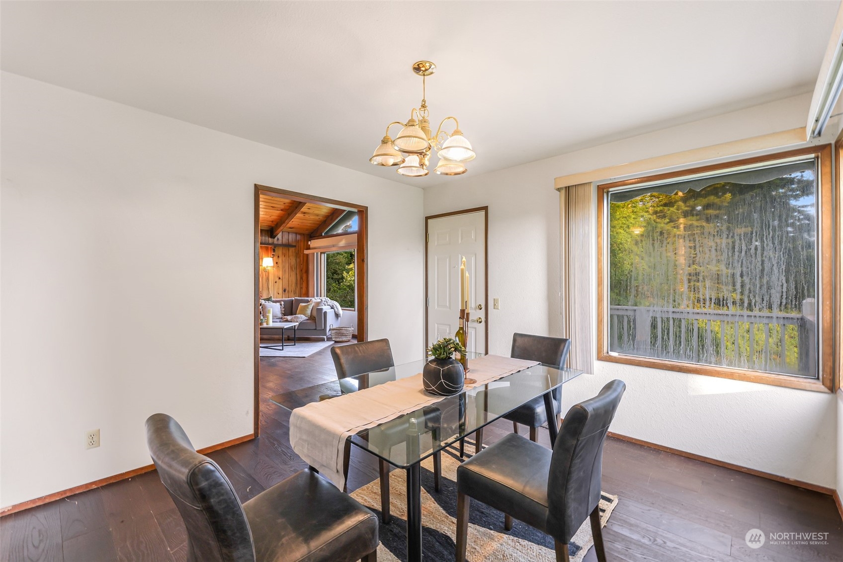 2835 Thornton Road Ferndale, WA 98248 - Photo 11 of 37 a view of a dining room with furniture wooden floor and a chandelier