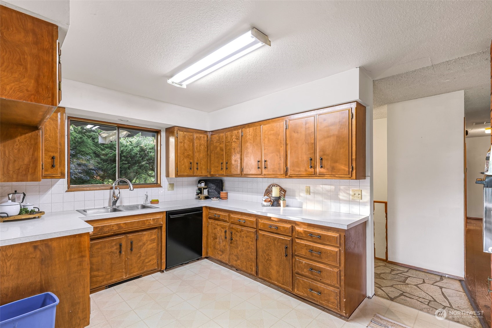 2835 Thornton Road Ferndale, WA 98248 - Photo 15 of 37 a kitchen with a sink window and cabinets