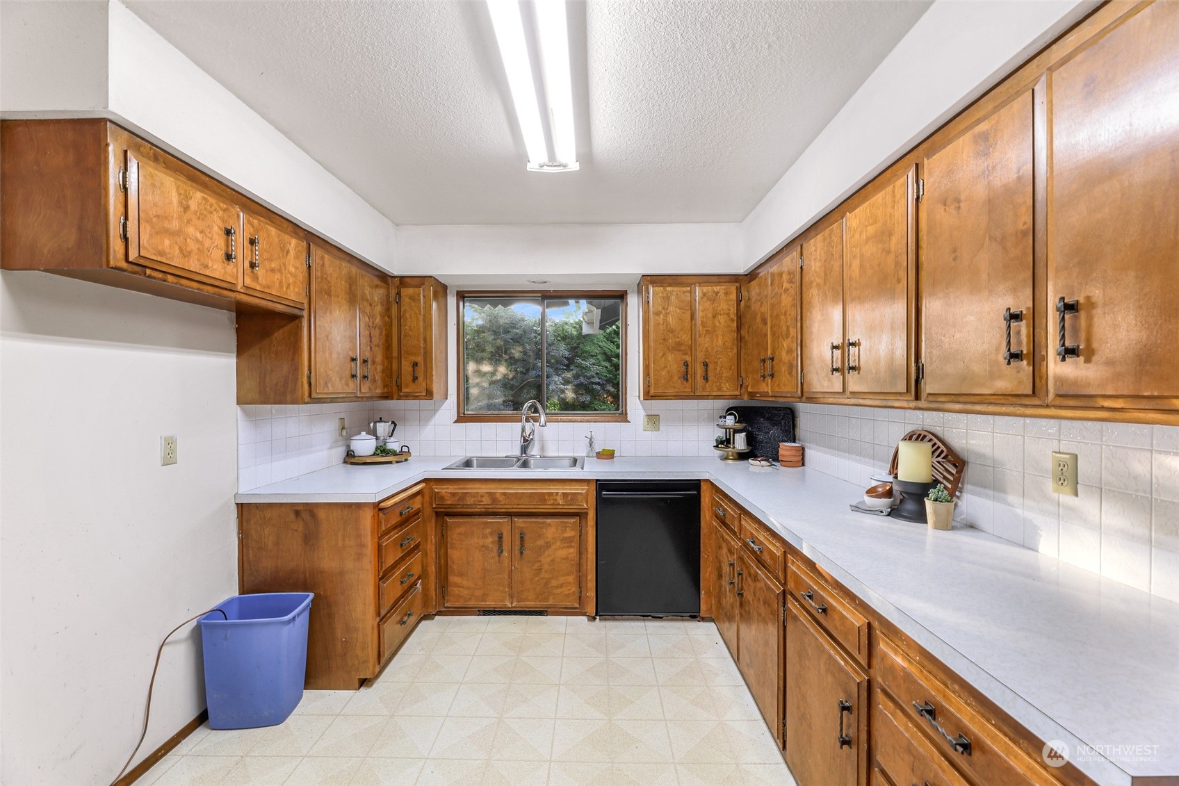 2835 Thornton Road Ferndale, WA 98248 - Photo 16 of 37 a kitchen with a sink a window stainless steel appliances and cabinets