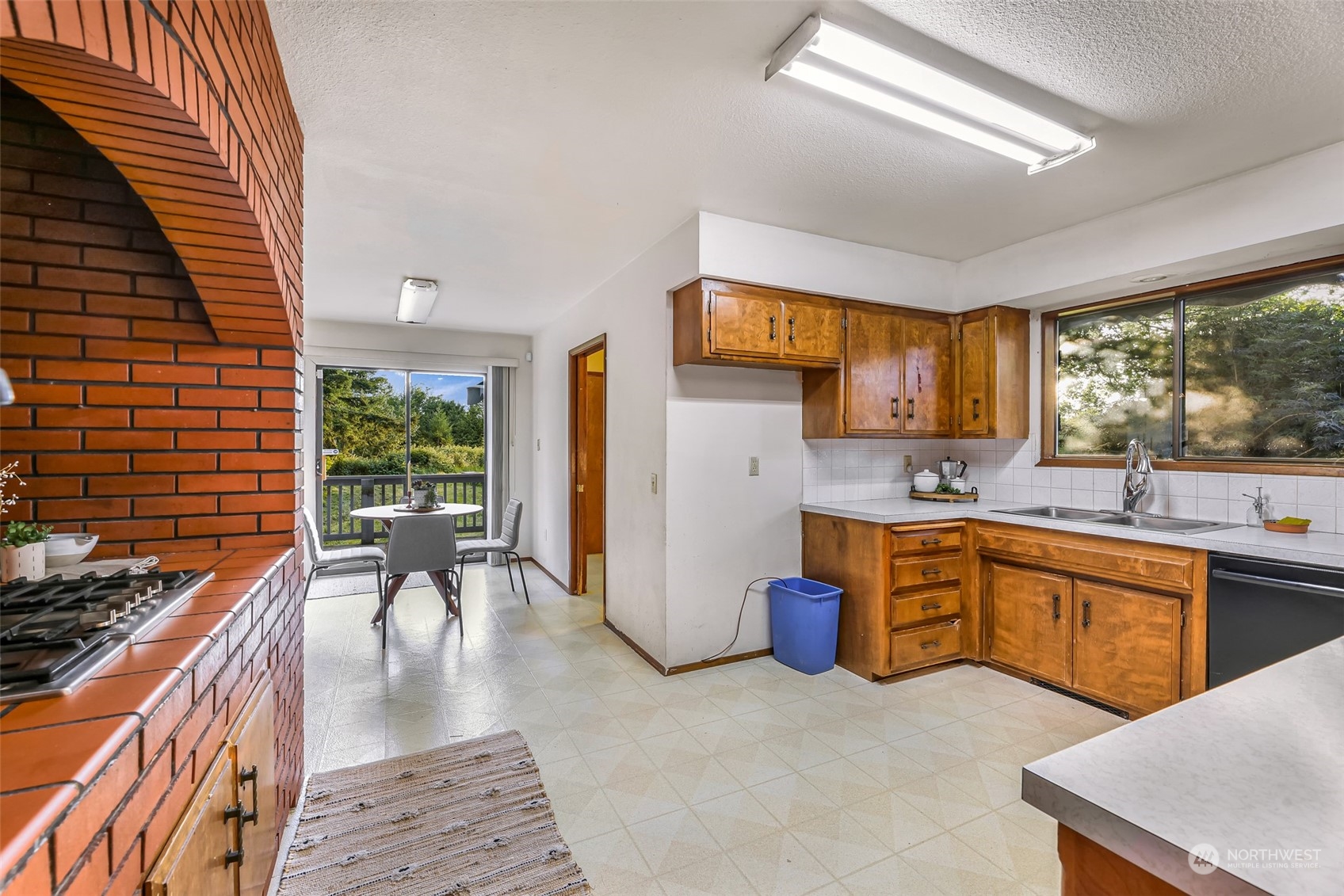 2835 Thornton Road Ferndale, WA 98248 - Photo 18 of 37 a kitchen with a sink a stove a refrigerator and furniture