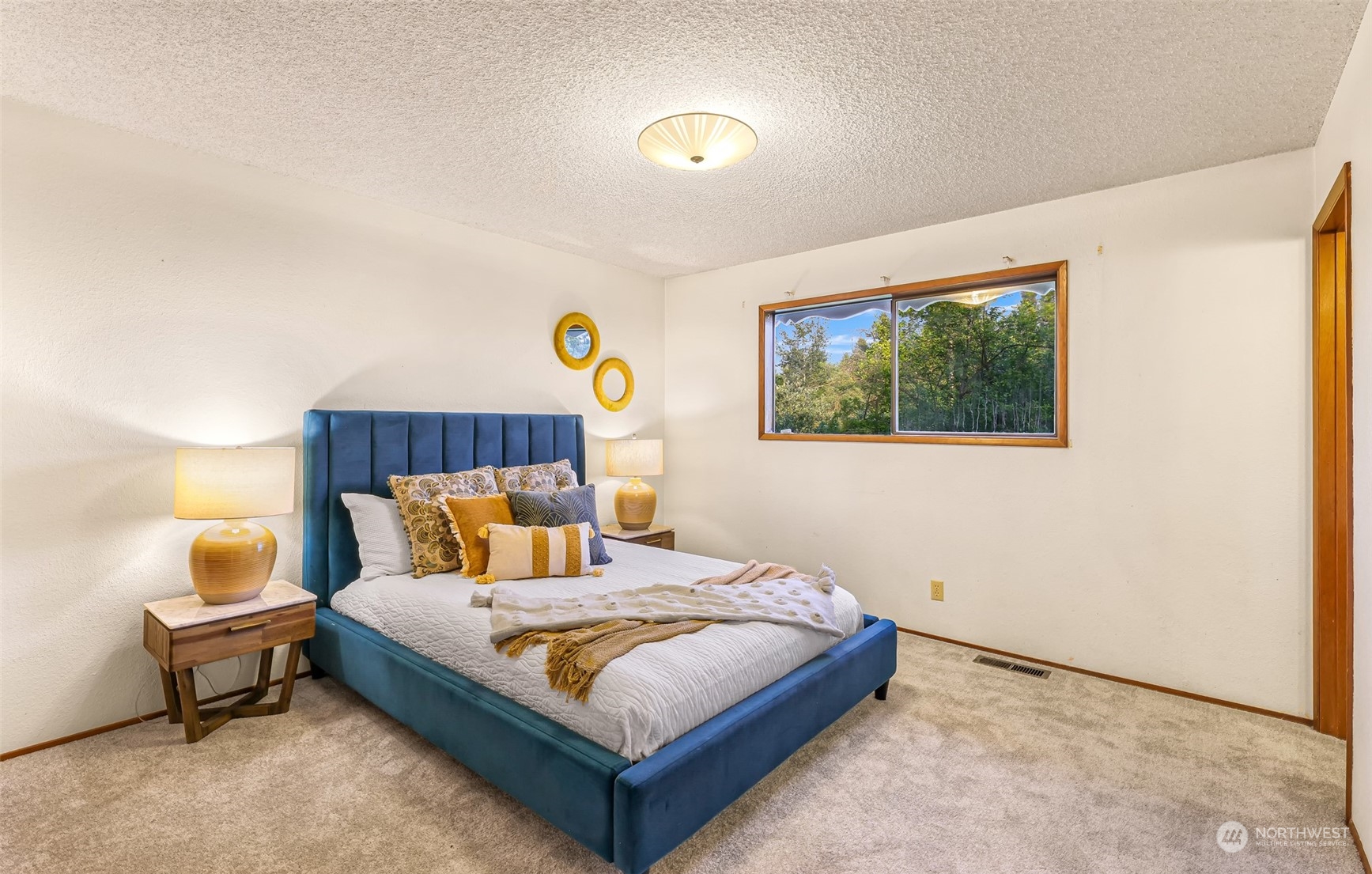 2835 Thornton Road Ferndale, WA 98248 - Photo 20 of 37 a bedroom with a bed and a potted plant