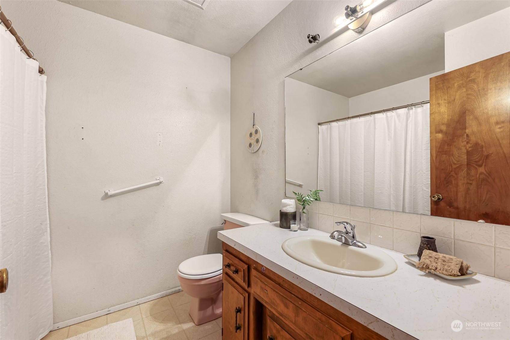 2835 Thornton Road Ferndale, WA 98248 - Photo 25 of 37 a bathroom with a toilet a sink and mirror