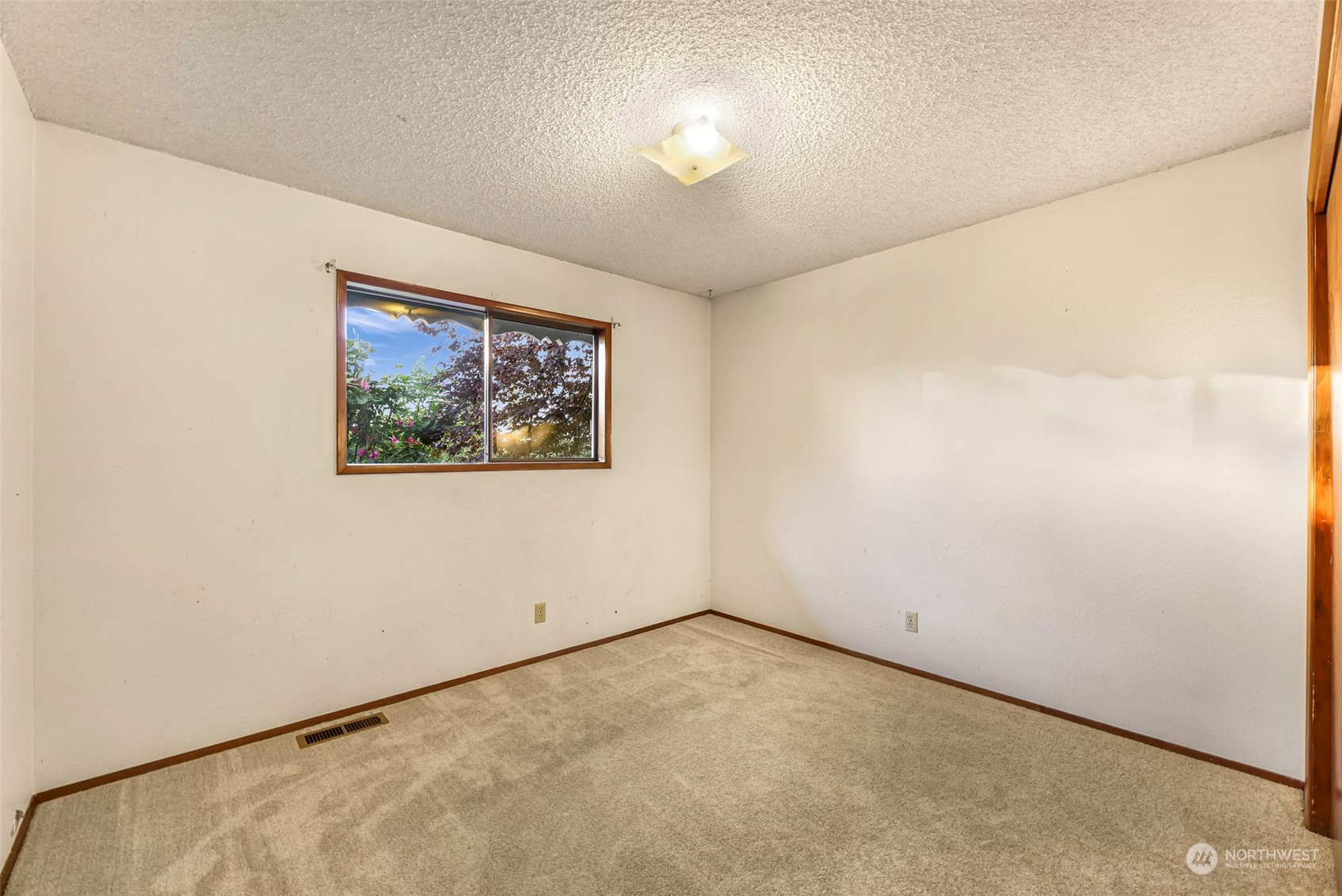 2835 Thornton Road Ferndale, WA 98248 - Photo 26 of 37 an empty room with a painting on the wall