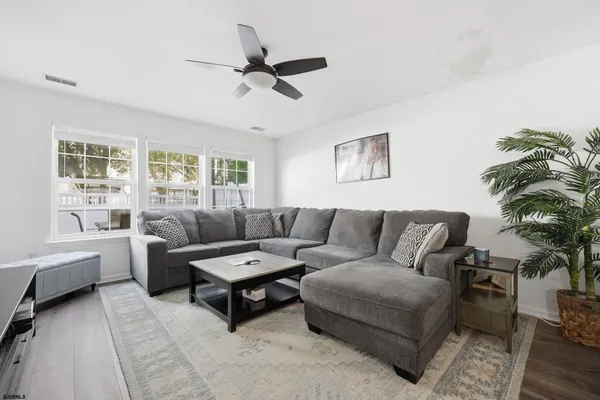 a living room with furniture and a large window
