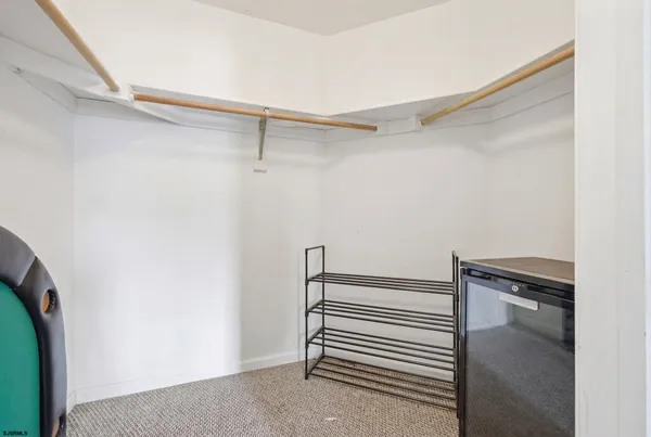 a view of a room with racks on the wall