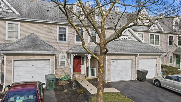 a front view of a house with garage