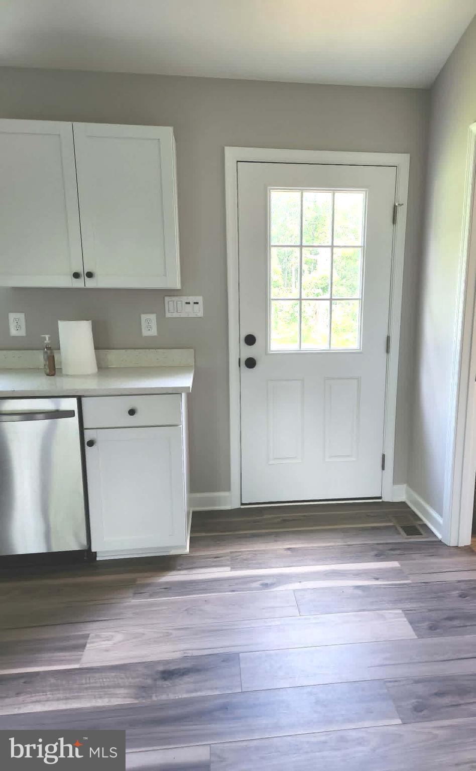 11501 Homeland Road Rixeyville, VA 22737 - Photo 24 of 53 a view of empty room with wooden floor and fan