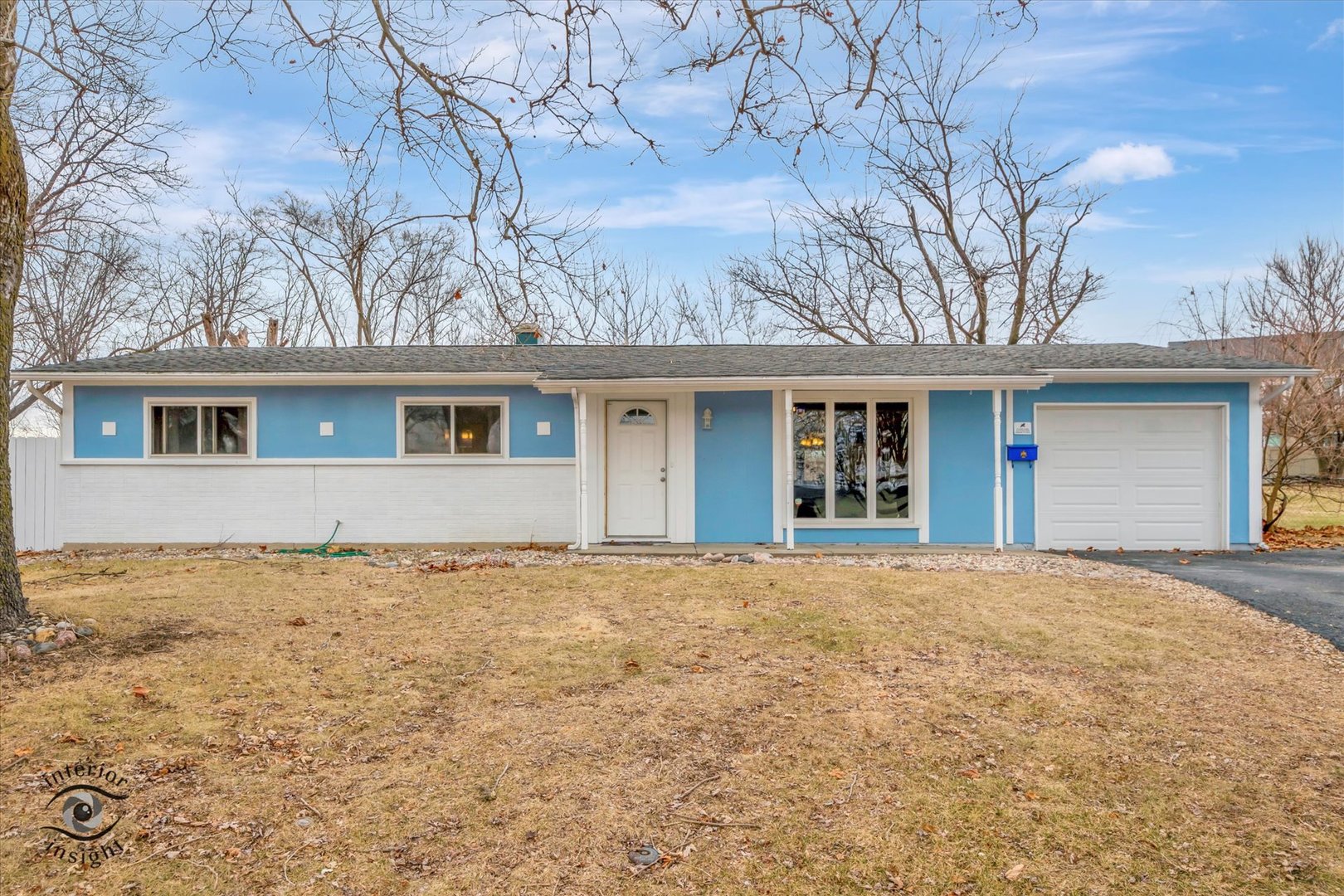 front view of a house with a yard