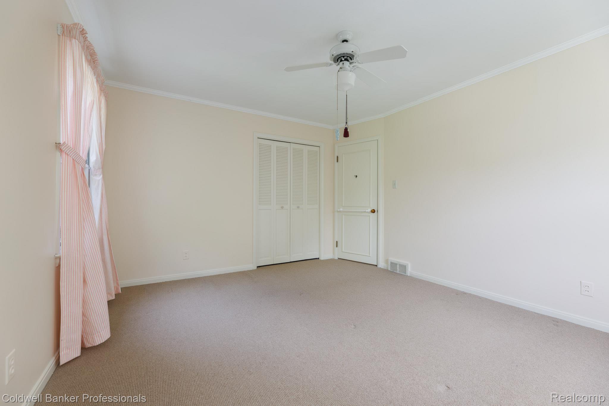 1018 Harvard Road Grosse Pointe, MI 48230 - Photo 24 of 40 Interior room featuring neutral wall paint, light-colored carpeting, and white trim