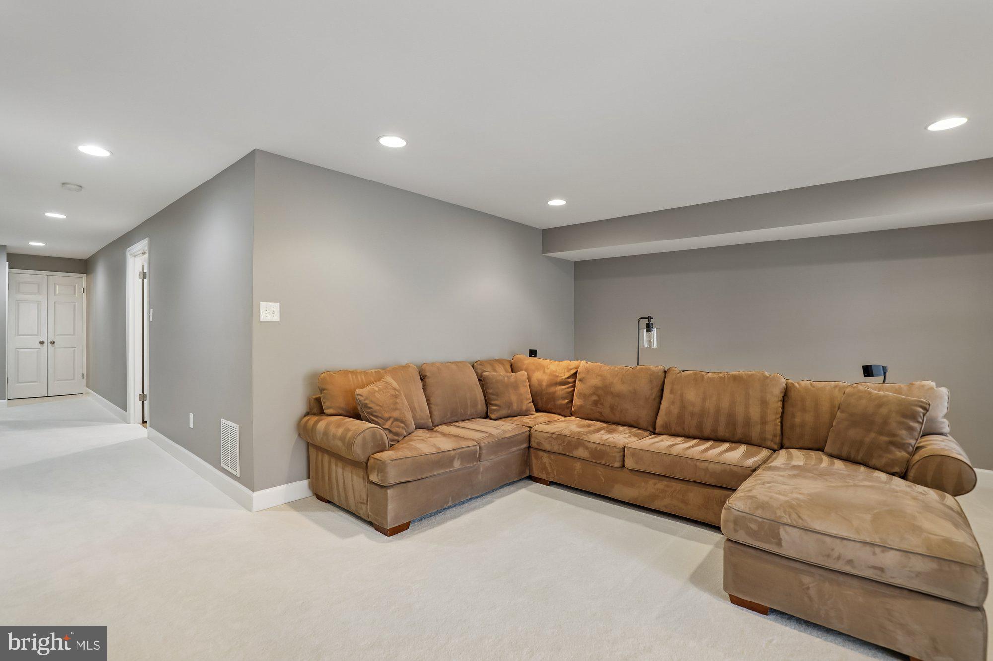 8019 Galla Knoll Circle Springfield, VA 22153 - Photo 42 of 57 a living room with furniture and a couch