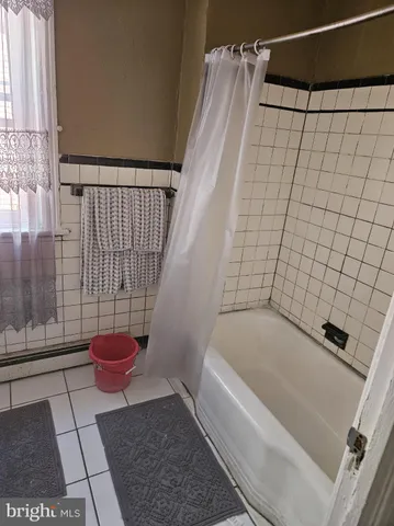 a bathroom with a shower and a toilet