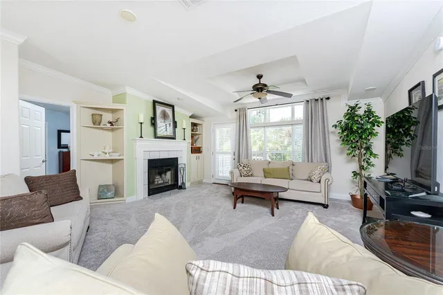 a living room with furniture window and a fireplace