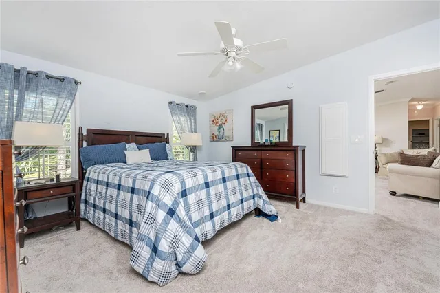 a bedroom with a bed and a couch