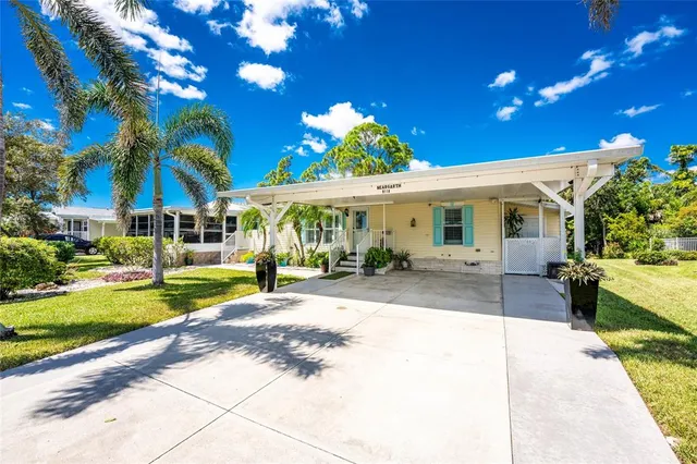 a view of a house with swimming pool and a yard