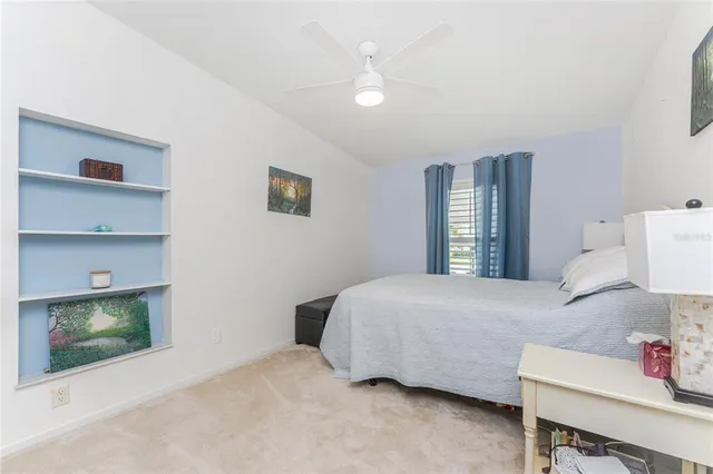 a bedroom with a bed and a fireplace