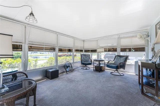 a room with gym equipment and large window