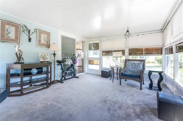 a view of a livingroom with furniture and windows