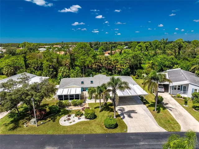 an aerial view of a house with swimming pool