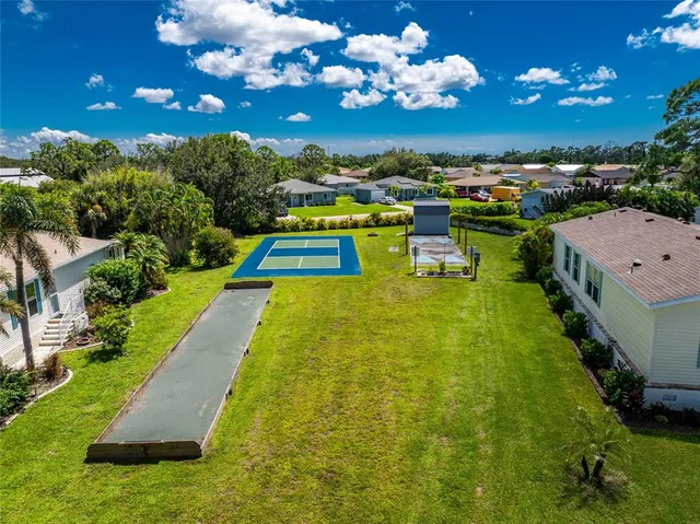 a view of a swimming pool with a table and chairs