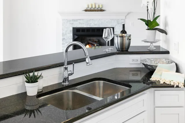 a stove top oven sitting inside of a kitchen