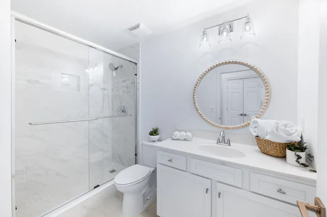 a view of a white building among the street