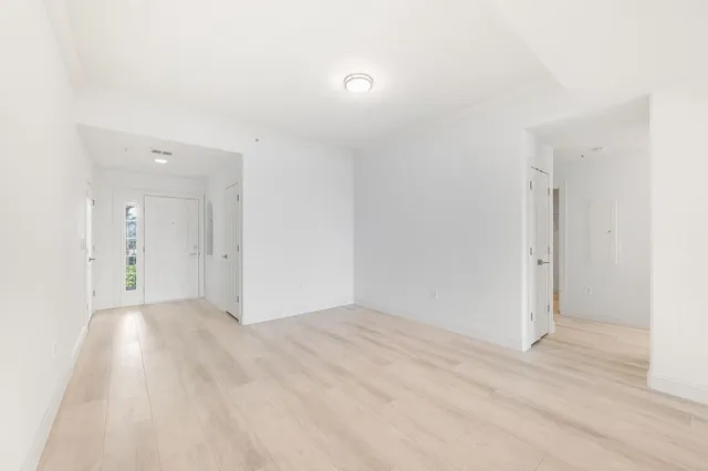 a kitchen with stainless steel appliances a sink and a large window