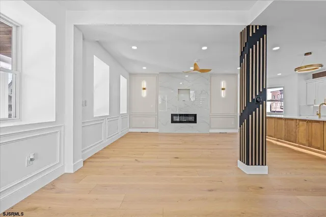 a kitchen with a refrigerator and a sink