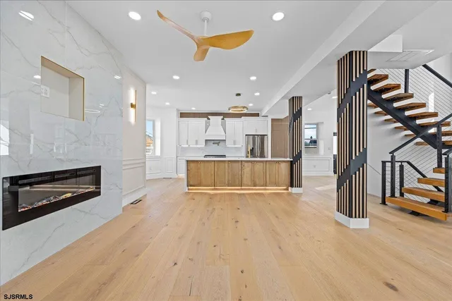 a kitchen with a sink and natural light