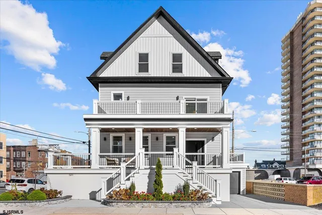 a view of a porch with furniture and a gate