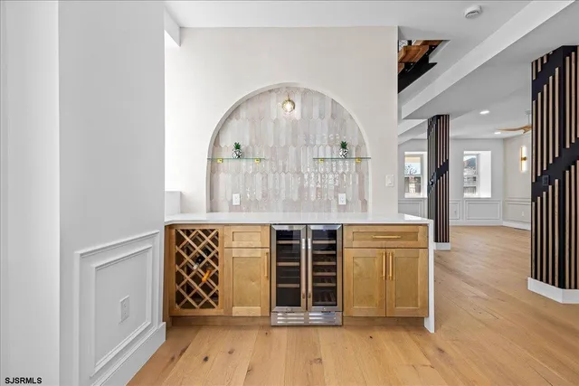 a view of an entryway with wooden floor