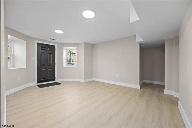 a view of a balcony with wooden floor