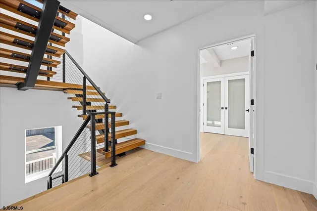 a white bath tub sitting in a bathroom