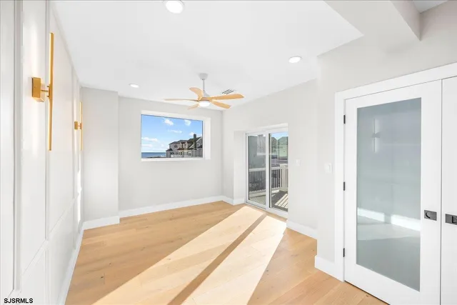 a view of an empty room with windows