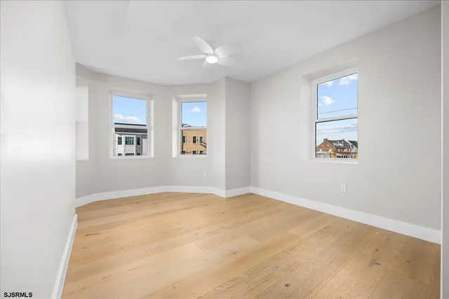 a view of a bathroom from a hallway