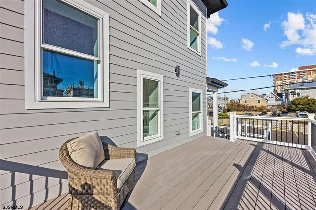 a view of kitchen and hall with wooden floor