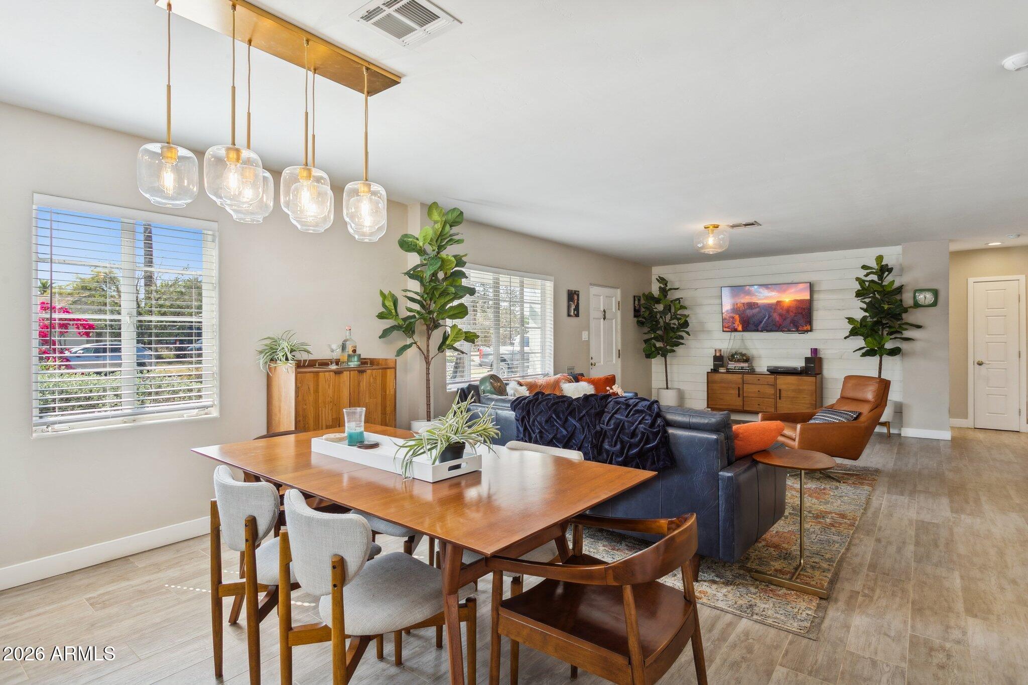 322 West Coronado Road Phoenix, AZ 85003 - Photo 50 of 93 a view of a dining room with furniture wooden floor and chandelier