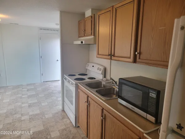 a kitchen with a stove and a microwave