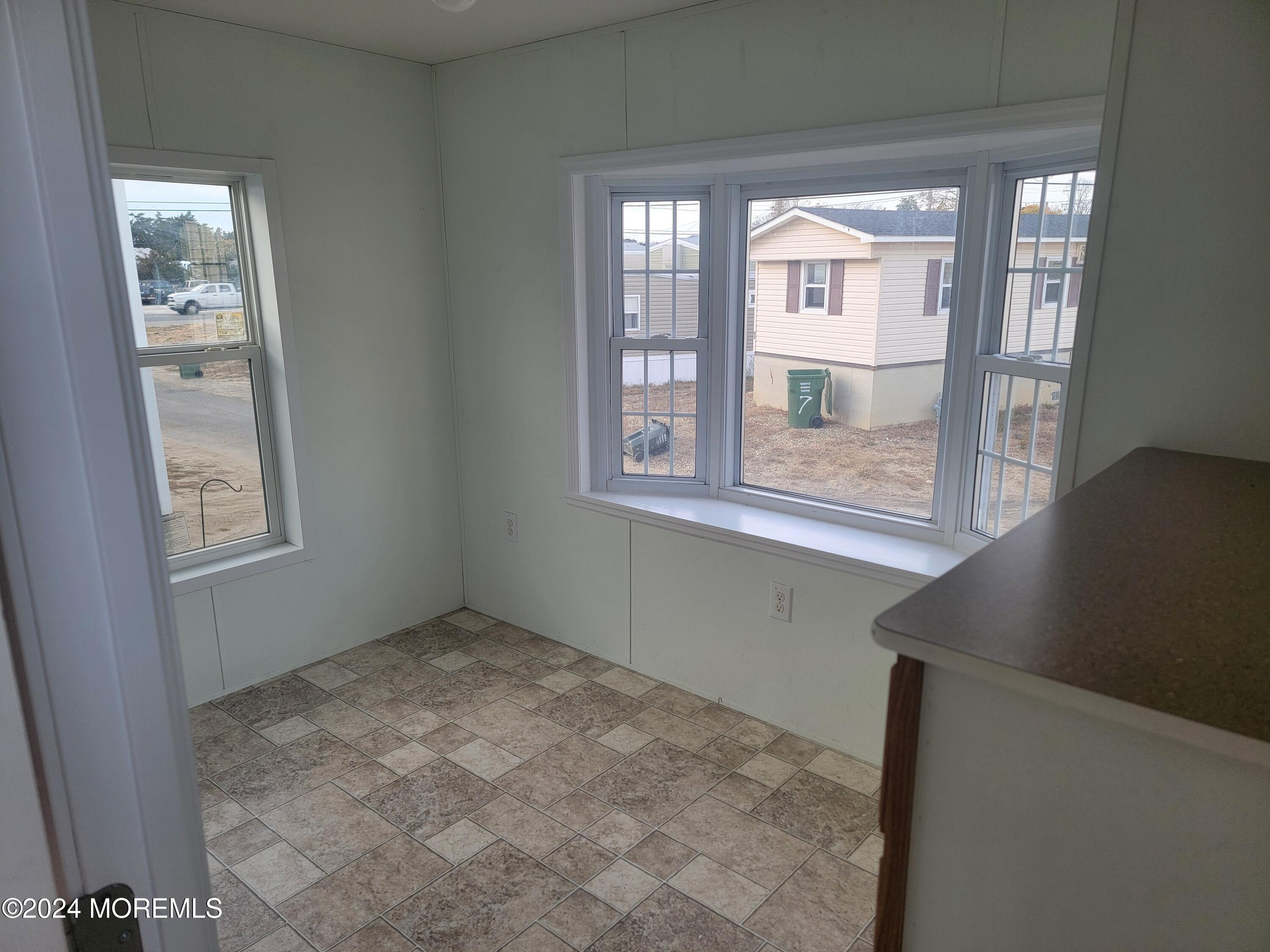 469 South Green Street, Unit 7 Tuckerton, NJ 08087 - Photo 9 of 11 an empty room with a window