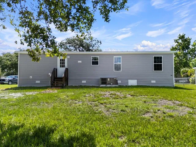 a backyard of a house with lots of green space