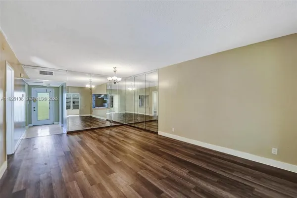 a view of an empty room with a fireplace