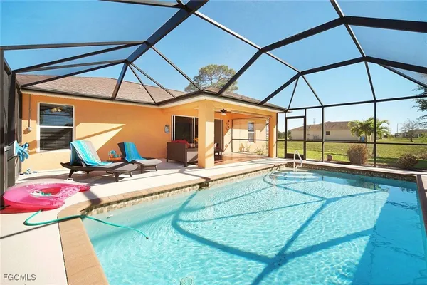 a patio with a table and chairs