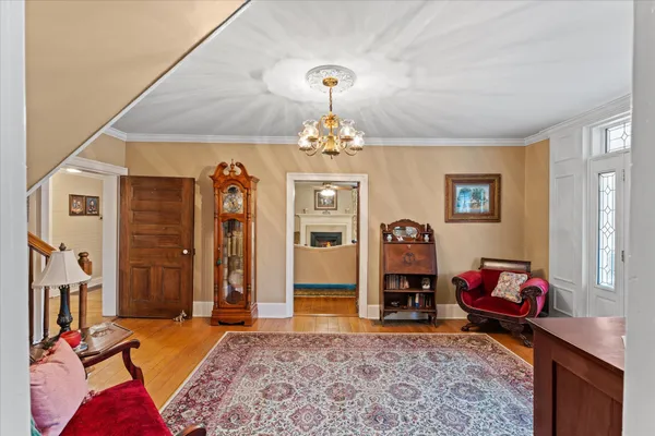 a living room with fireplace furniture and a flat screen tv