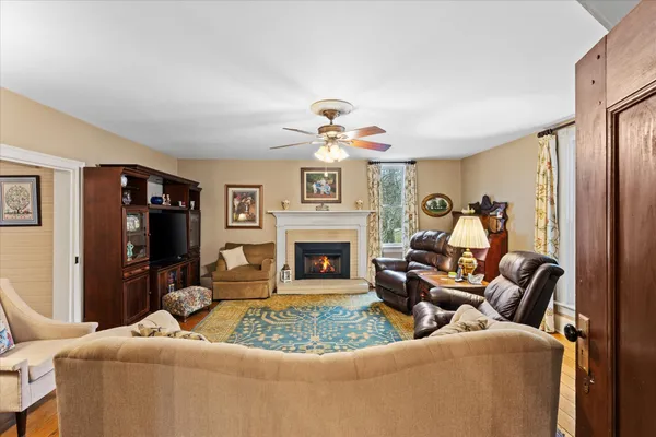 a living room with furniture and a fireplace