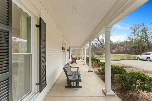 a view of entryway with wooden floor