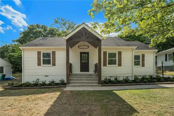 a front view of a house with garden