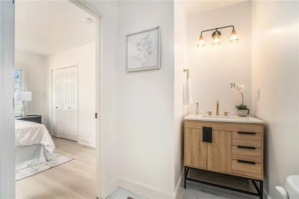 a view of utility room and bedroom