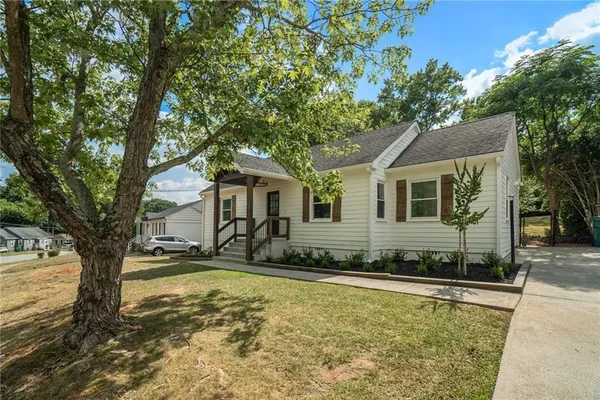 a front view of a house with a yard